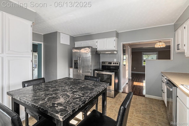 17325 Doris, Fraser, MI 48026 - kitchen with appliances with stainless steel finishes, under cabinet range hood, white cabinetry, and ornamental molding