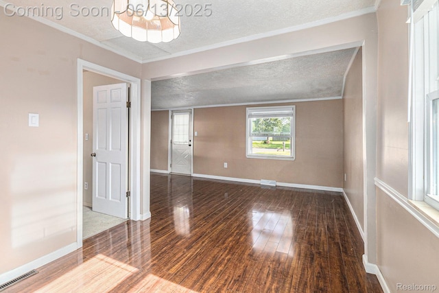 17325 Doris, Fraser, MI 48026 - unfurnished room with a textured ceiling, hardwood / wood-style flooring, a chandelier, and ornamental molding