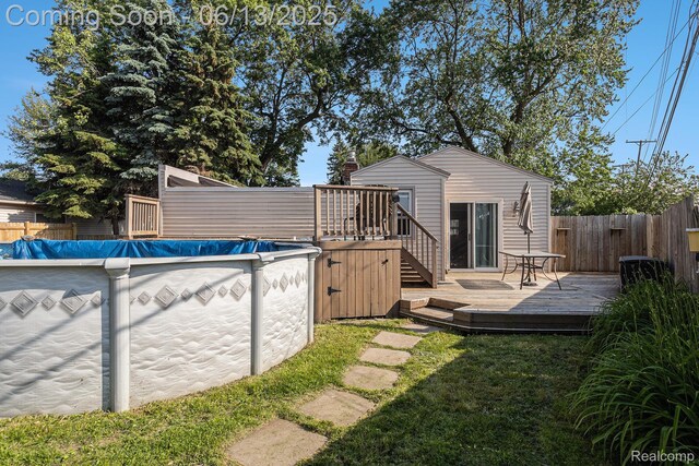 17325 Doris, Fraser, MI 48026 - back of property with a deck and stairway