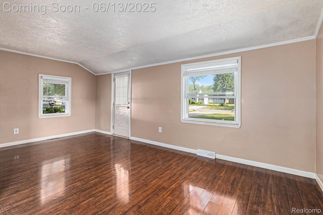 17325 Doris, Fraser, MI 48026 - empty room with healthy amount of natural light, a textured ceiling, wood-type flooring, crown molding, and lofted ceiling