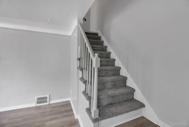 12702-12710 Kelly Rd, Detroit, MI 48224 - stairs featuring wood finished floors and baseboards