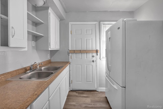 12702-12710 Kelly Rd, Detroit, MI 48224 - kitchen with refrigerator, open shelves, white cabinetry, and wood finished floors