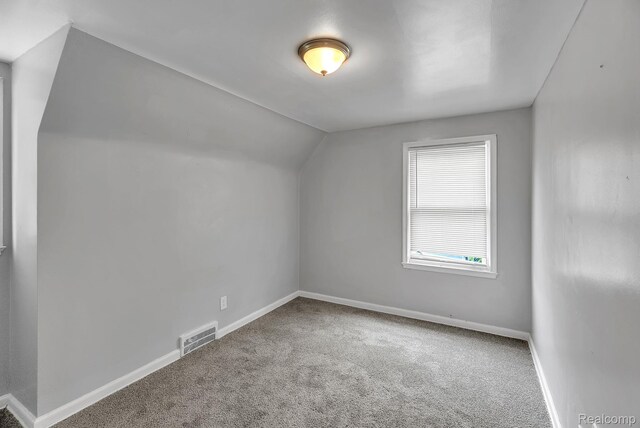 12702-12710 Kelly Rd, Detroit, MI 48224 - bonus room featuring carpet floors and vaulted ceiling