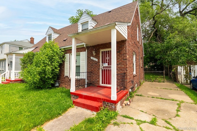 12702-12710 Kelly Rd, Detroit, MI 48224 - view of front facade featuring brick siding and roof with shingles