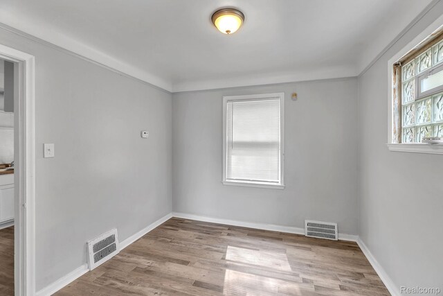 12702-12710 Kelly Rd, Detroit, MI 48224 - spare room with wood finished floors and baseboards