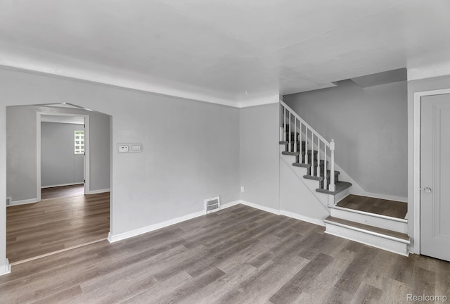 12702-12710 Kelly Rd, Detroit, MI 48224 - unfurnished living room featuring wood finished floors and stairs