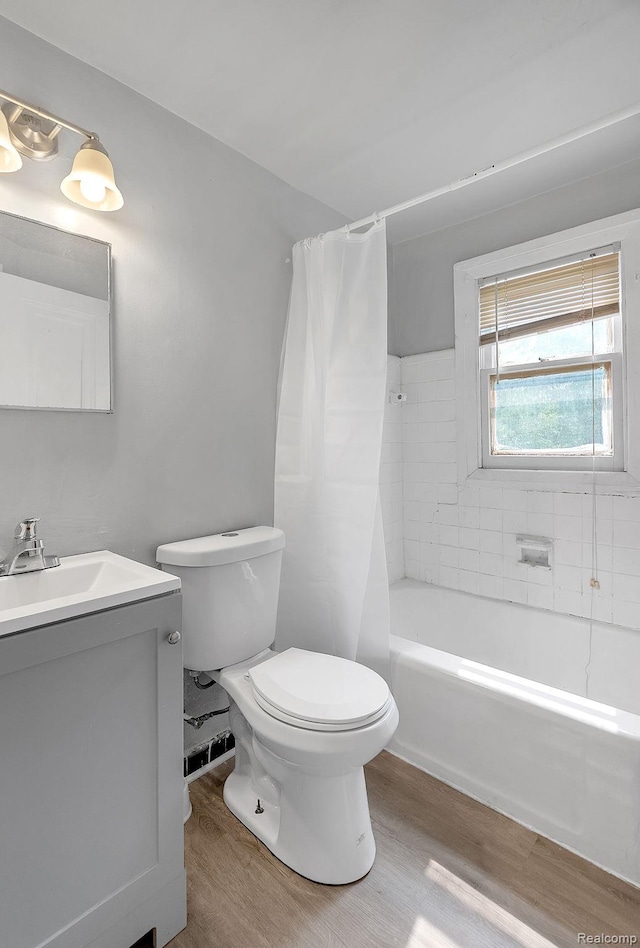 12702-12710 Kelly Rd, Detroit, MI 48224 - full bathroom featuring wood finished floors, vanity, and shower / bath combination with curtain