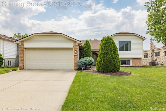 47425 Barbara Rd, Macomb, MI 48044 - view of front of property featuring brick siding, concrete driveway, a front yard, and an attached garage