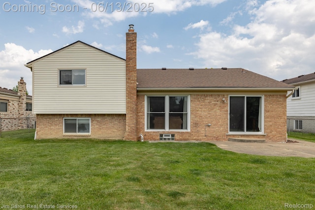 47425 Barbara Rd, Macomb, MI 48044 - rear view of property with brick siding, a patio, a shingled roof, and a chimney