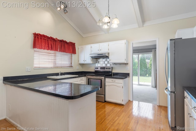 47425 Barbara Rd, Macomb, MI 48044 - kitchen featuring appliances with stainless steel finishes, a peninsula, dark countertops, under cabinet range hood, and a chandelier