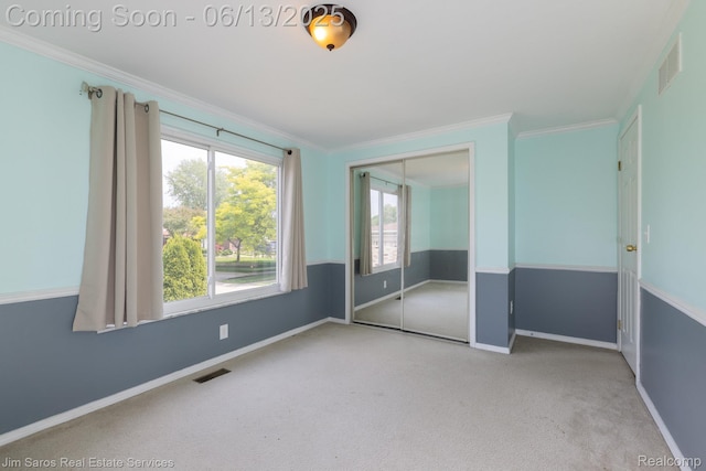 47425 Barbara Rd, Macomb, MI 48044 - unfurnished bedroom featuring carpet, baseboards, crown molding, and a closet