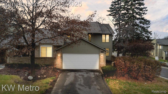 4013 Foxpointe Dr, West Bloomfield, MI 48323 - view of front of home with brick siding, driveway, and an attached garage