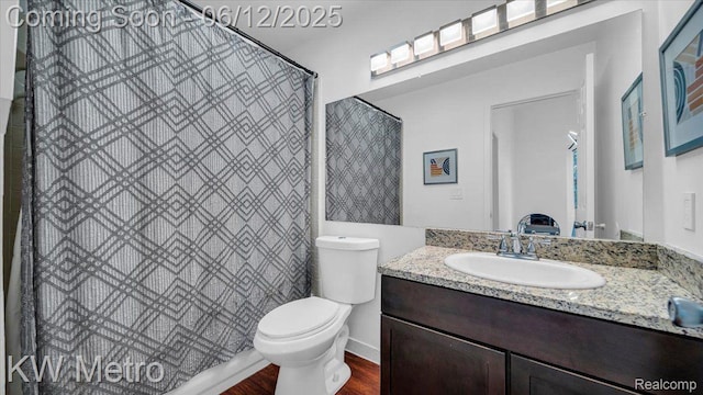 4013 Foxpointe Dr, West Bloomfield, MI 48323 - bathroom with toilet, vanity, wood finished floors, and a shower with curtain
