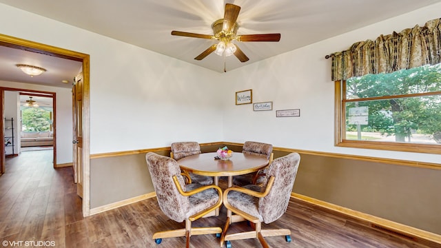 16486 Three Oaks Rd, Three Oaks, MI 49128 - dining space featuring a ceiling fan, wood finished floors, and baseboards