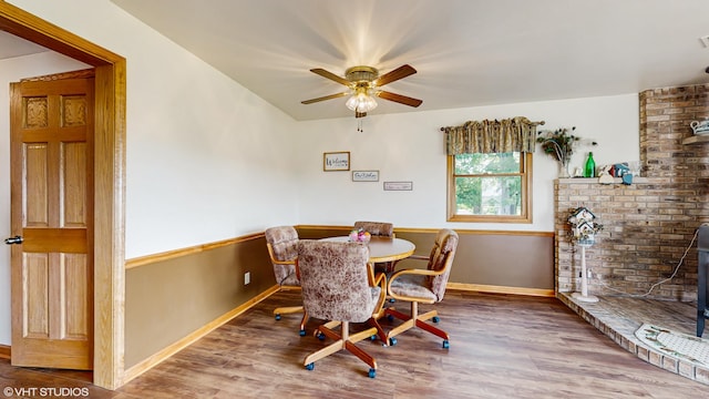 16486 Three Oaks Rd, Three Oaks, MI 49128 - dining area featuring wood finished floors, ceiling fan, and baseboards