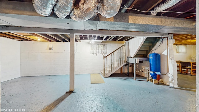 16486 Three Oaks Rd, Three Oaks, MI 49128 - unfinished below grade area with a water pressure tank and stairs