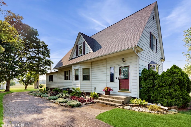 16486 Three Oaks Rd, Three Oaks, MI 49128 - view of front of house featuring roof with shingles and a front yard