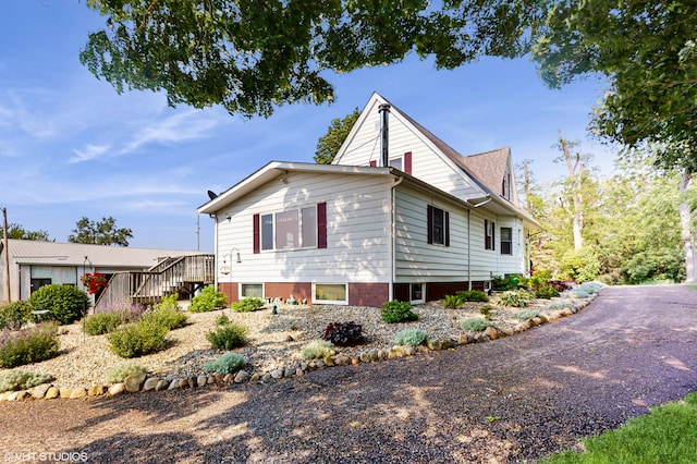16486 Three Oaks Rd, Three Oaks, MI 49128 - view of home's exterior featuring stairway