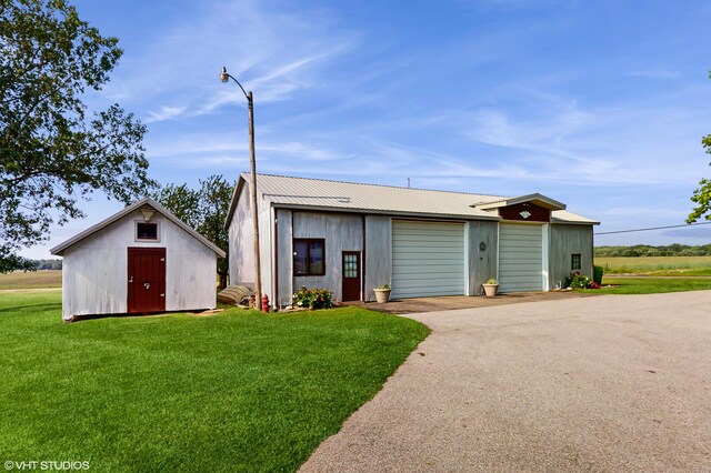 16486 Three Oaks Rd, Three Oaks, MI 49128 - view of outbuilding featuring driveway and a garage