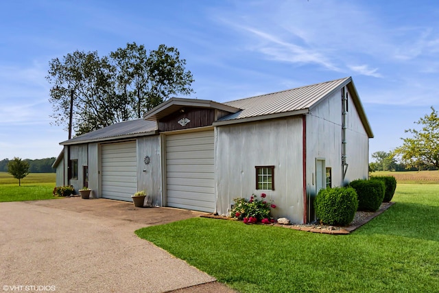 16486 Three Oaks Rd, Three Oaks, MI 49128 - view of front of house with metal roof, a front lawn, and an outdoor structure