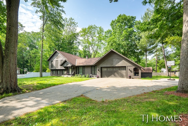 2605 Shadowbrook Dr SE, Grand Rapids, MI 49546 - split level home with an attached garage, driveway, and brick siding