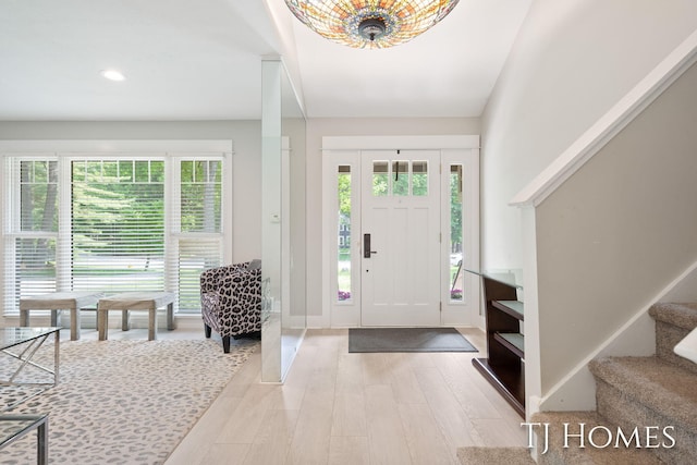 2605 Shadowbrook Dr SE, Grand Rapids, MI 49546 - entrance foyer featuring light wood-style floors, healthy amount of natural light, stairs, recessed lighting, and baseboards