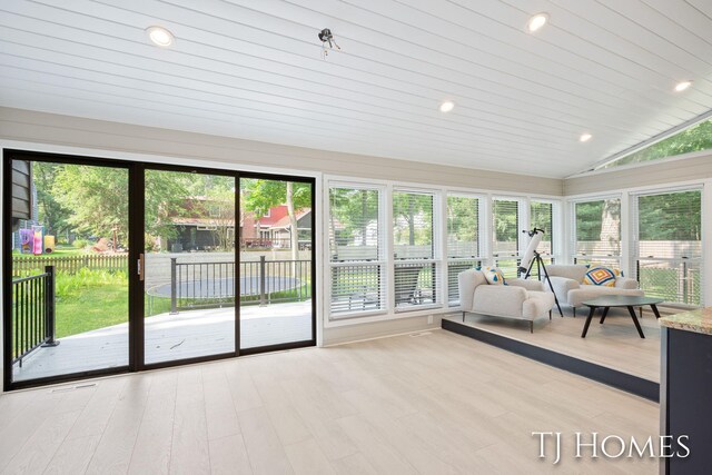 2605 Shadowbrook Dr SE, Grand Rapids, MI 49546 - sunroom / solarium with lofted ceiling, plenty of natural light, wood finished floors, and recessed lighting