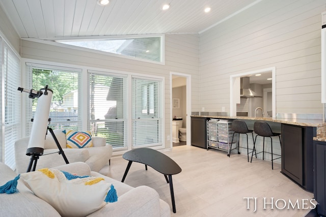 2605 Shadowbrook Dr SE, Grand Rapids, MI 49546 - living room with wood walls, high vaulted ceiling, recessed lighting, light wood-style flooring, and wood ceiling