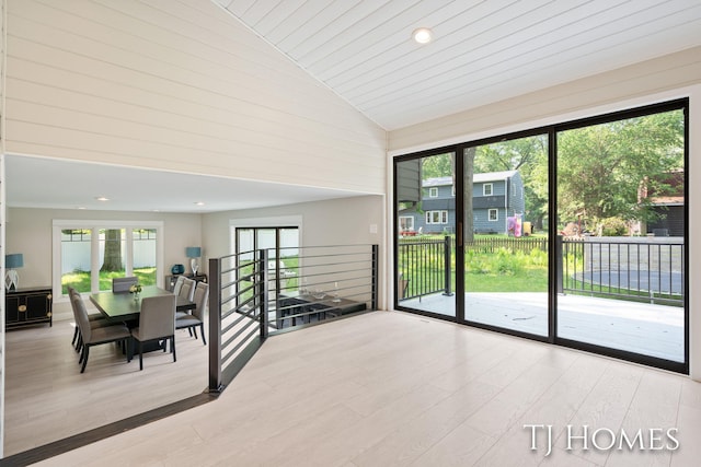 2605 Shadowbrook Dr SE, Grand Rapids, MI 49546 - dining space featuring wood finished floors, high vaulted ceiling, and recessed lighting