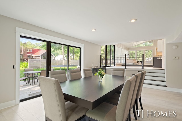 2605 Shadowbrook Dr SE, Grand Rapids, MI 49546 - dining space featuring baseboards, lofted ceiling, and recessed lighting