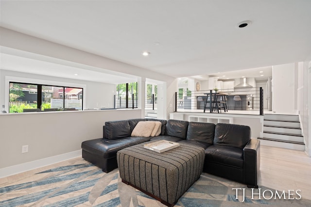 2605 Shadowbrook Dr SE, Grand Rapids, MI 49546 - living area featuring healthy amount of natural light, baseboards, recessed lighting, light wood-style floors, and stairs
