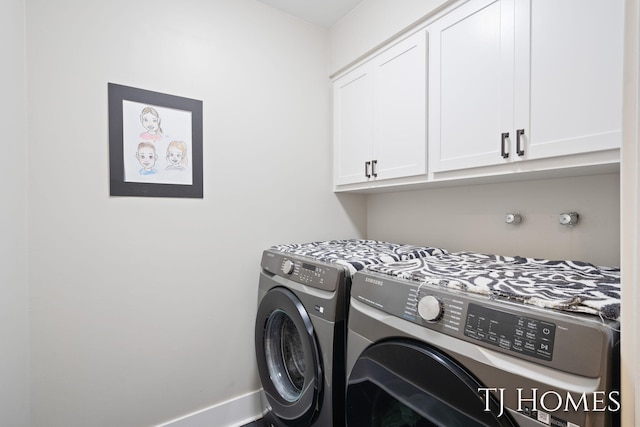 2605 Shadowbrook Dr SE, Grand Rapids, MI 49546 - laundry area with cabinet space, washer and dryer, and baseboards