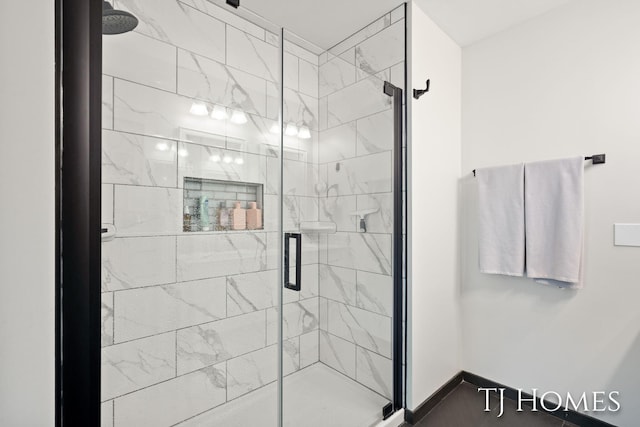 2605 Shadowbrook Dr SE, Grand Rapids, MI 49546 - bathroom featuring a shower stall and baseboards