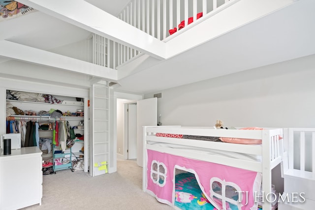 2605 Shadowbrook Dr SE, Grand Rapids, MI 49546 - bedroom featuring carpet flooring, a closet, and a high ceiling