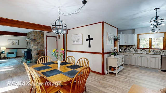 2258 High Rd, Roscommon, MI 48653 - dining space featuring a chandelier and light wood-style flooring