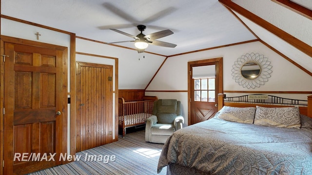 2258 High Rd, Roscommon, MI 48653 - bedroom with carpet floors, lofted ceiling, wainscoting, and wooden walls