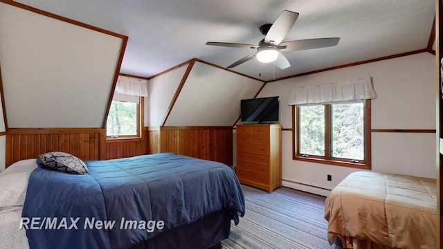 2258 High Rd, Roscommon, MI 48653 - carpeted bedroom with a baseboard radiator, wood walls, wainscoting, crown molding, and ceiling fan