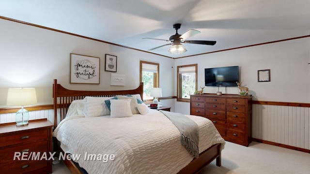 2258 High Rd, Roscommon, MI 48653 - bedroom featuring carpet floors, a wainscoted wall, a ceiling fan, and crown molding
