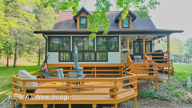 2258 High Rd, Roscommon, MI 48653 - view of front facade featuring a wooden deck and roof with shingles