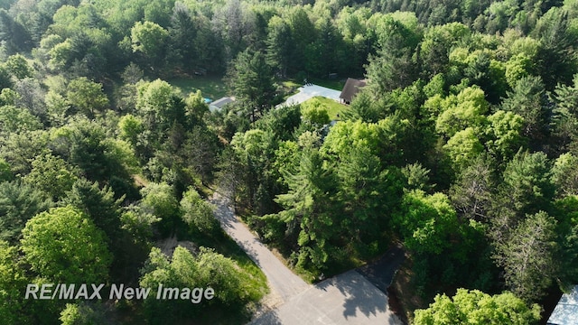 2258 High Rd, Roscommon, MI 48653 - aerial view of property and surrounding area featuring a heavily wooded area