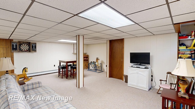 2258 High Rd, Roscommon, MI 48653 - living area with a baseboard heating unit, carpet floors, and a drop ceiling