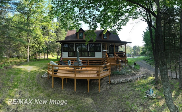 2258 High Rd, Roscommon, MI 48653 - back of property with a wooden deck