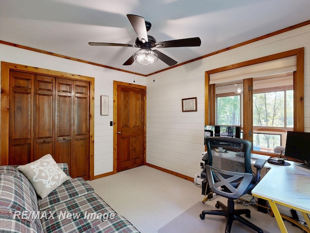 2258 High Rd, Roscommon, MI 48653 - home office with carpet, a ceiling fan, wooden walls, and ornamental molding