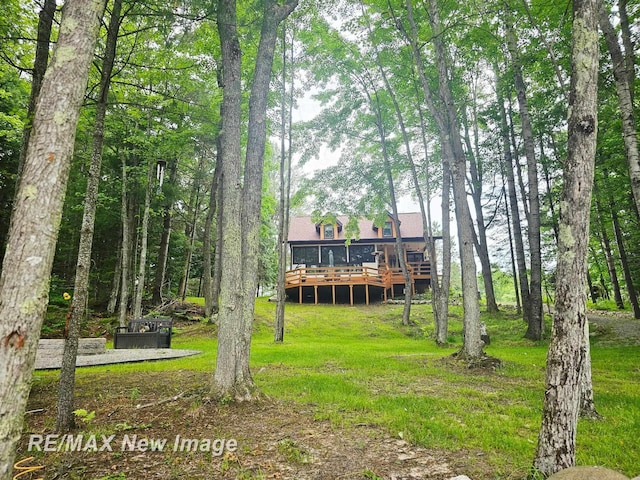 2258 High Rd, Roscommon, MI 48653 - view of green lawn with a deck
