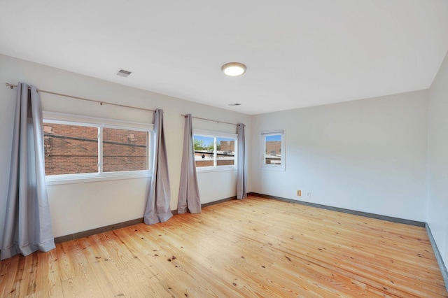 617 Elm St, Saint Joseph, MI 49085 - empty room featuring light wood-style flooring and baseboards