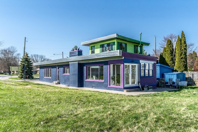 37252 Jefferson Ave, Harrison Township, MI 48045 - rear view of house with a yard and a chimney