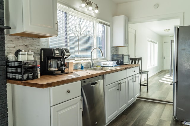 37252 Jefferson Ave, Harrison Township, MI 48045 - kitchen with butcher block counters, stainless steel appliances, decorative backsplash, a sink, and white cabinets