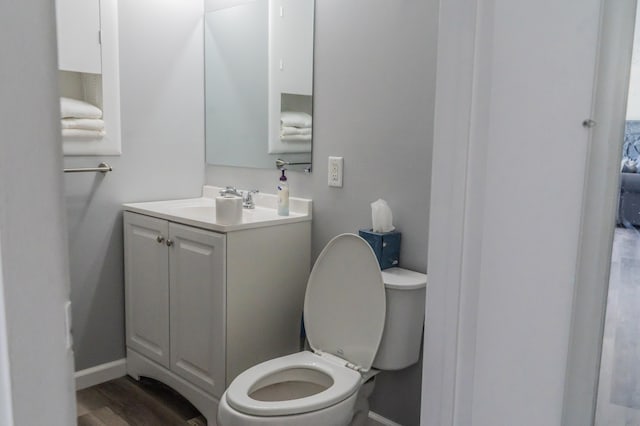 37252 Jefferson Ave, Harrison Township, MI 48045 - half bath with vanity, toilet, baseboards, and wood finished floors