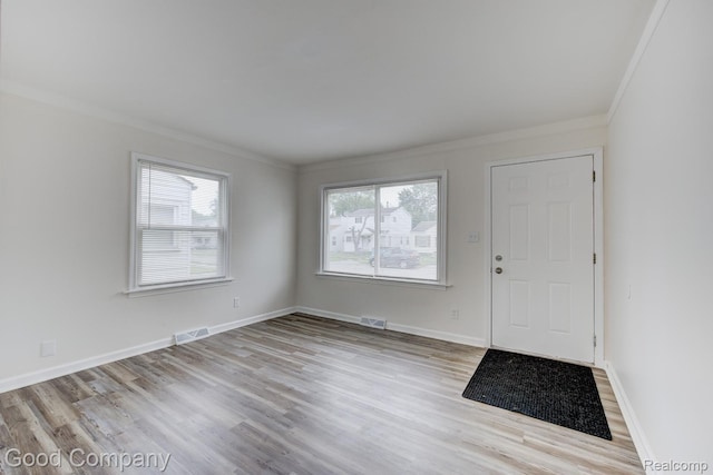 22811 Sharrow Ave, Utica, MI 48089 - entrance foyer featuring ornamental molding, healthy amount of natural light, and wood finished floors