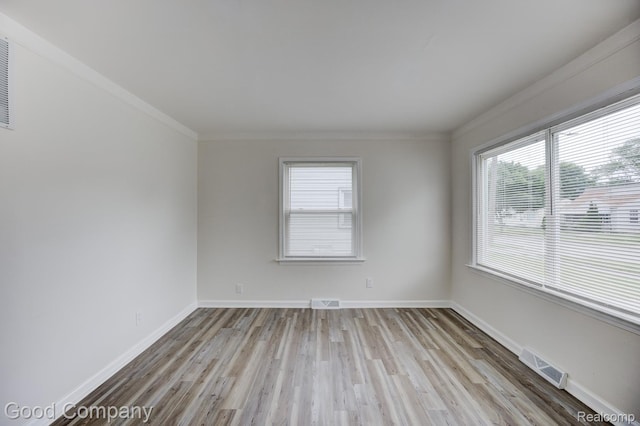22811 Sharrow Ave, Utica, MI 48089 - unfurnished room with healthy amount of natural light, wood finished floors, and ornamental molding